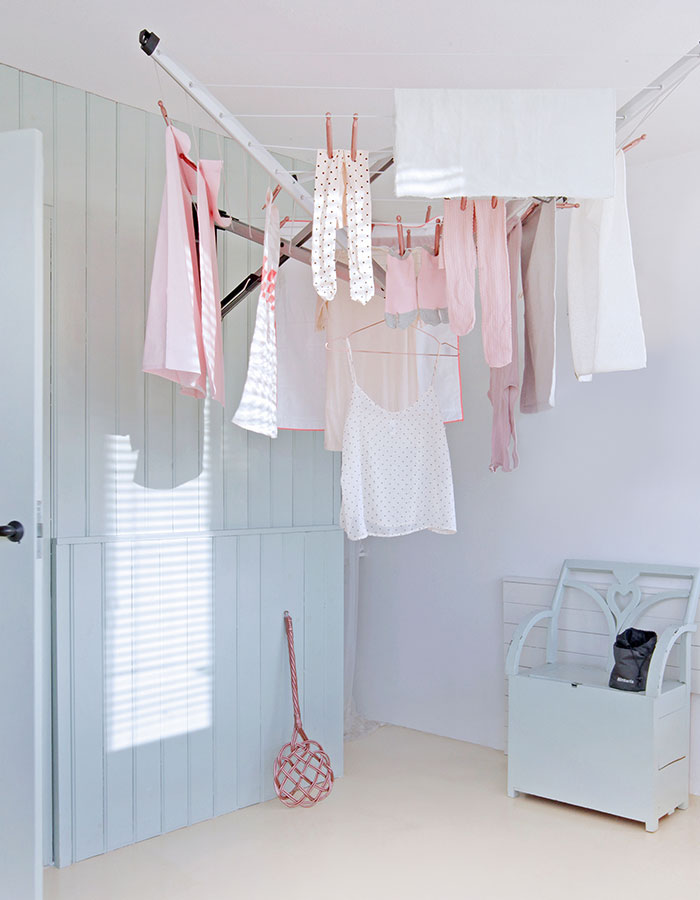 Wall-mounted clothes dryer as a space-saving option. Available in white. 